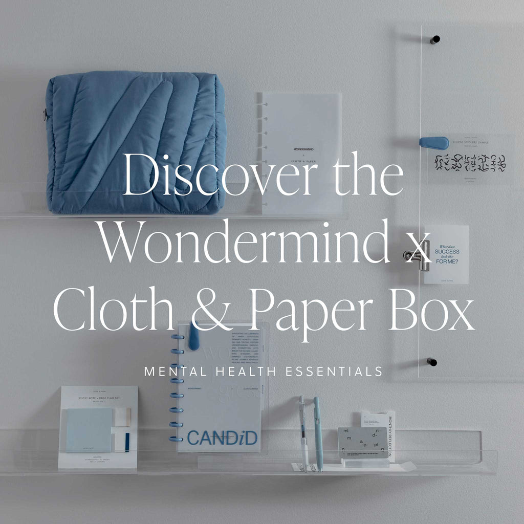 An image showing all the plannign tools included in the October 2024 Intention Box created in partnership with Wondermind, with text overlay that reads: "Discover the Wondermind x Cloth & Paper Box: Mental Health Essentials." 