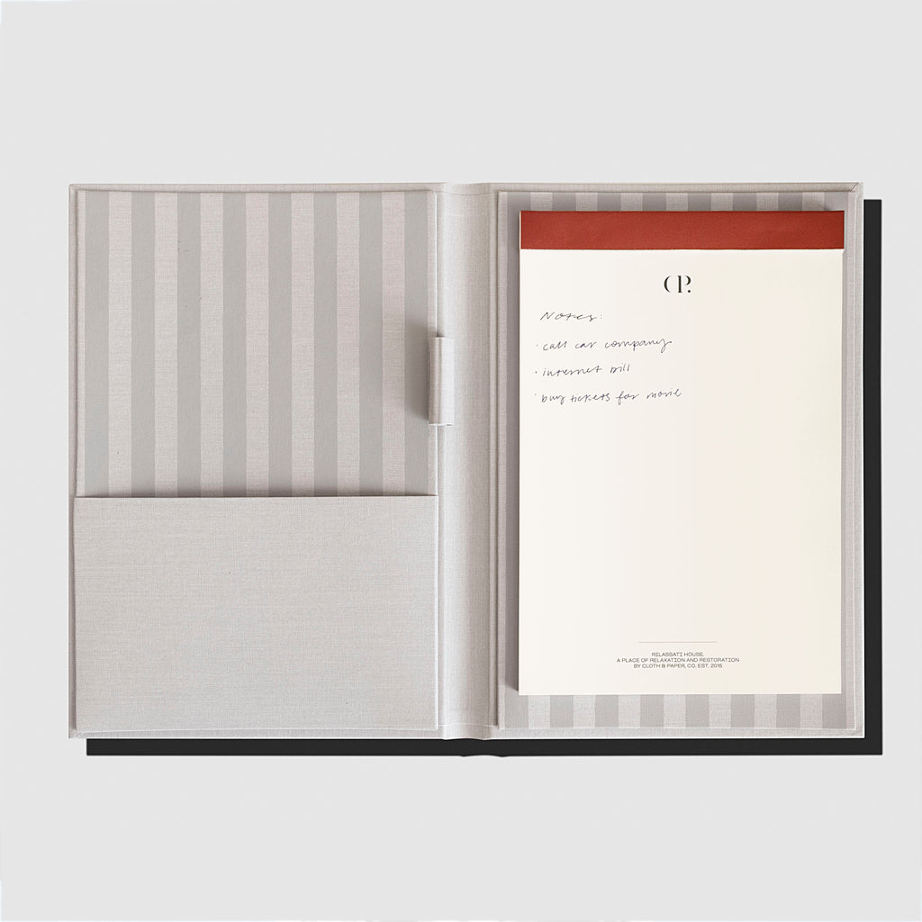 Notepad Folio, Rilassati, Cloth and Paper. Folio displayed with notepad inside it on a neutral background.