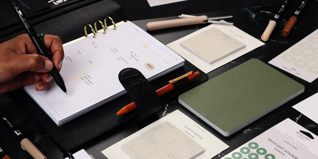 a preview image for our latest Happy Hour featuring new minimal planner inserts, sticky notes, and other surrounding planner accessories
