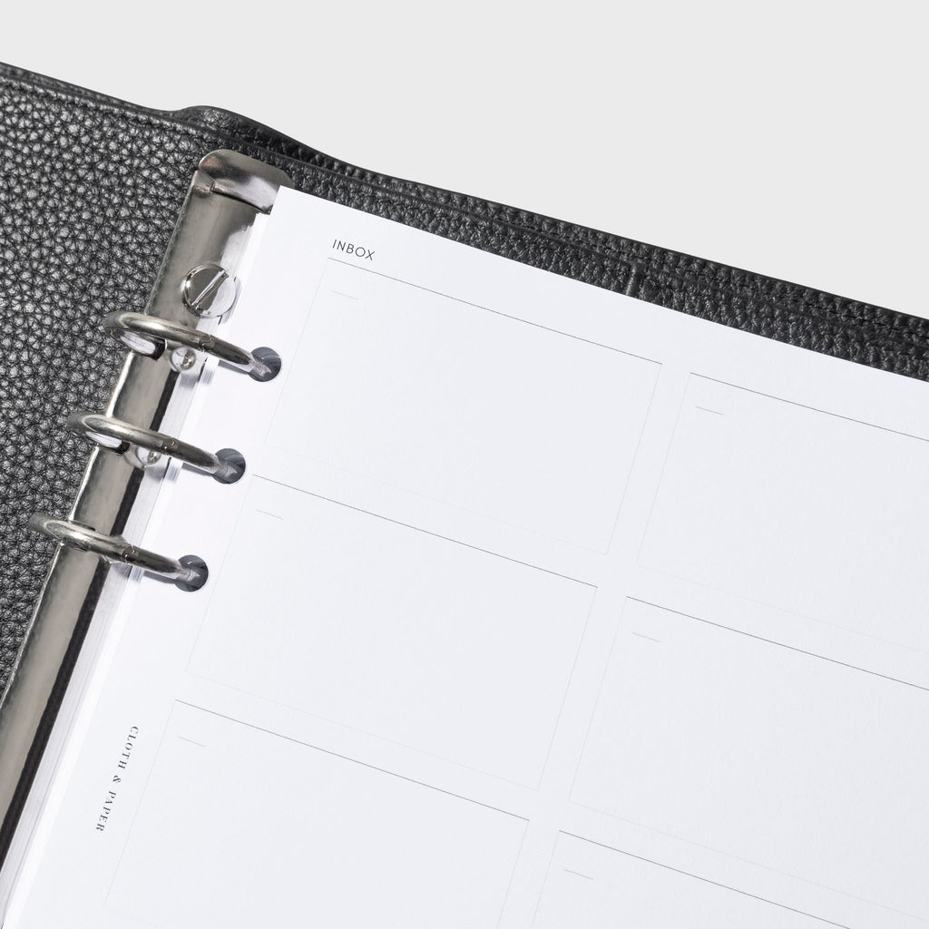 Closeup of insert inside a black leather agenda.