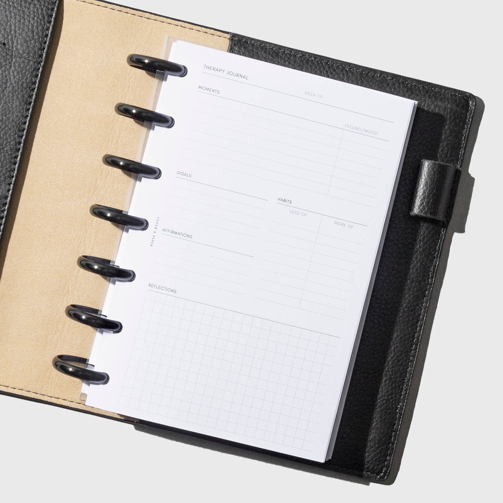 Insert shown in use inside a black leather agenda. Size shown is HP Mini.