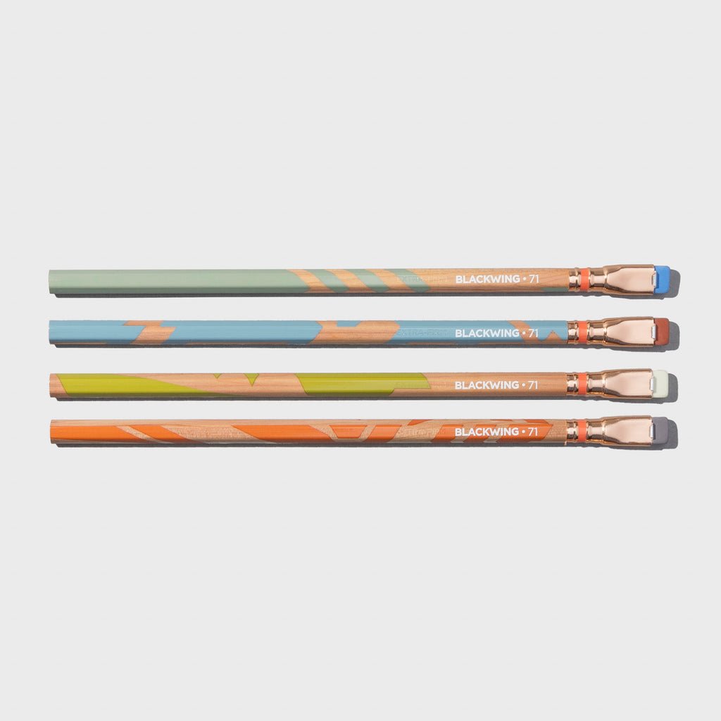 Set of four pencils displayed parallel on a neutral background. They are wooden and have gray, blue, green, or orange accents.