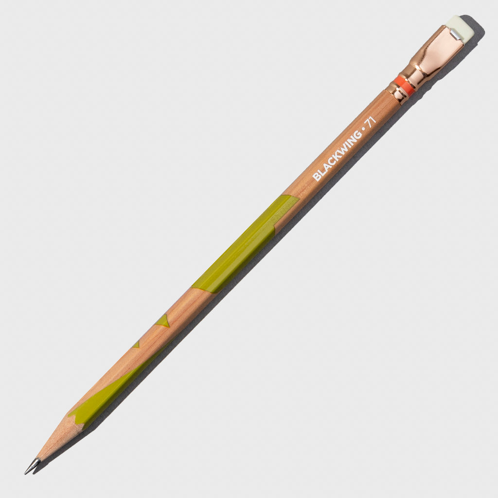 Wooden pencil with green accents displayed on a neutral background.