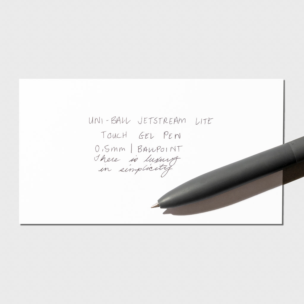 Image shows a pen test sheet of the Uni-ball Jetstream LiteTouch Gel Pen in Off Black.