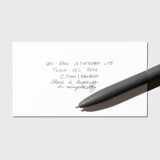 Image shows a pen test sheet of the Uni-ball Jetstream Lite Touch Gel Pen in Off Black.