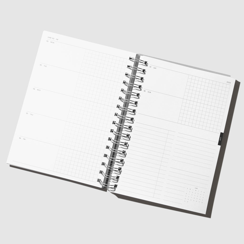 Notebook displayed open on a horizontal weekly layout.