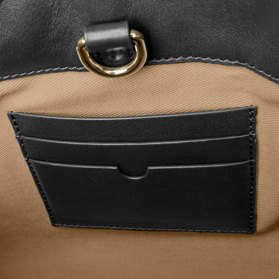 Closeup of credit card slots inside bag. Color shown is Padrillo.