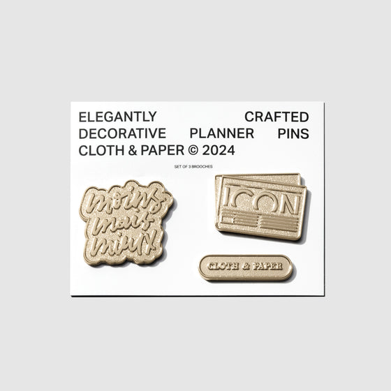 Planner Brooch Set, Cloth and Paper. Set of 3 pins on their backing on a neutral background.