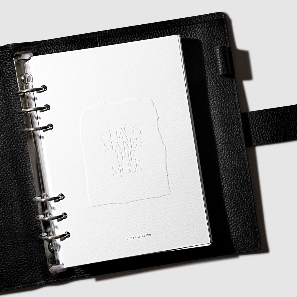 A5 dashboard displayed inside a black 
leather agenda.