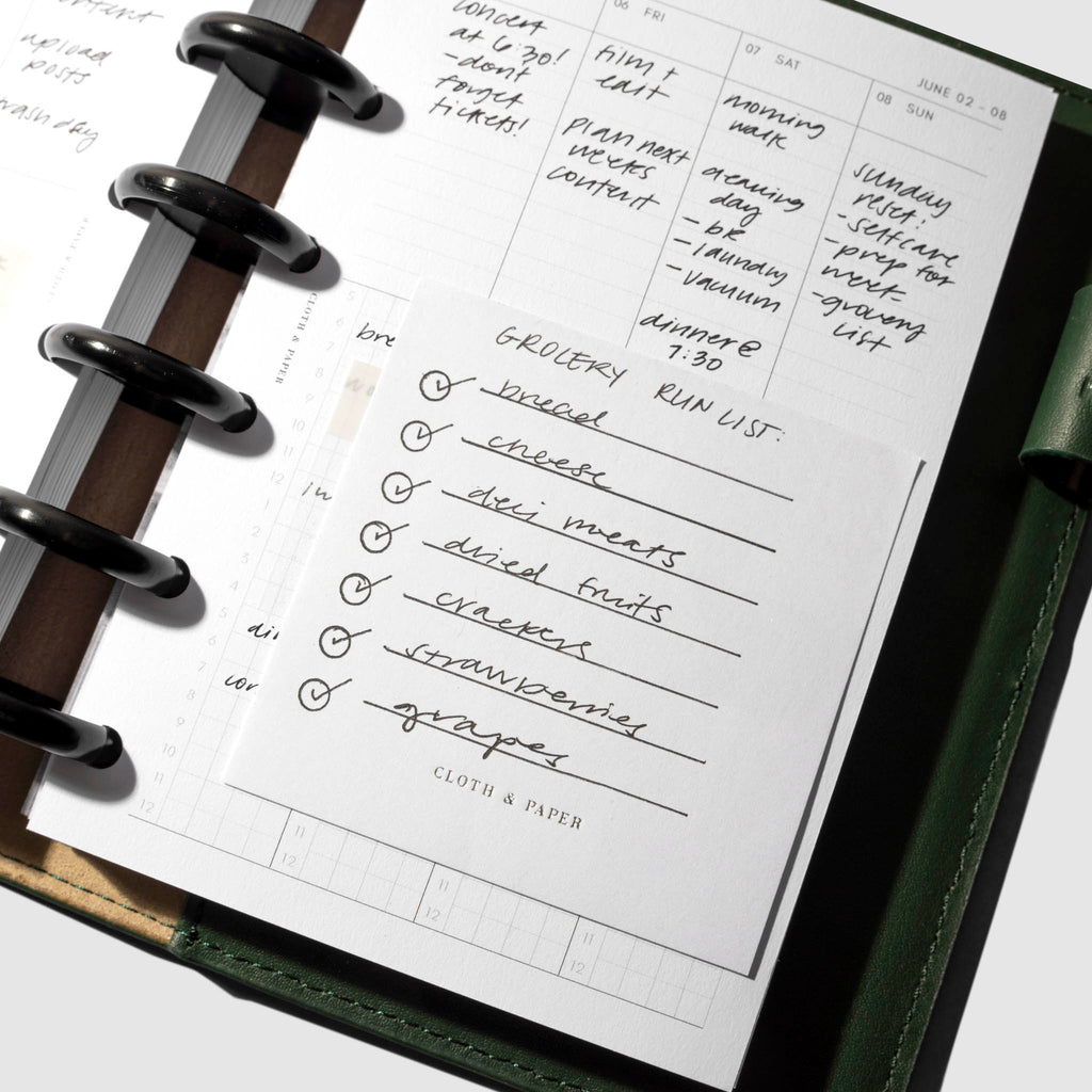 Sticky note in use inside a planner system.