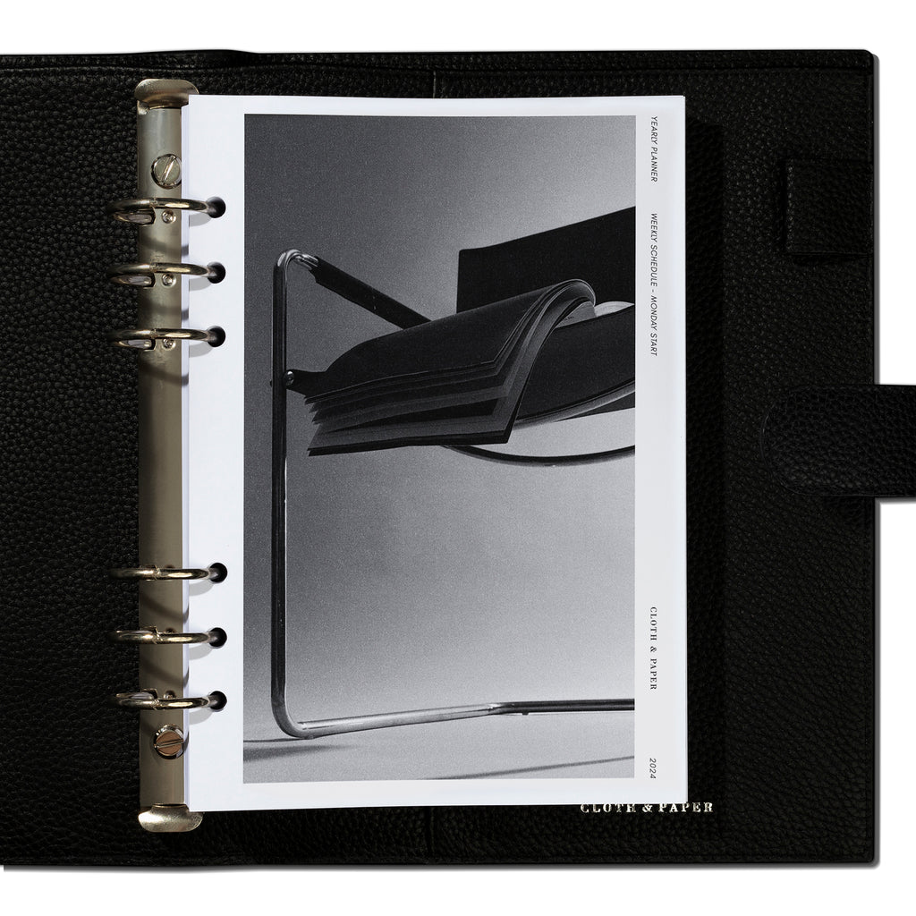 A5 inserts in use inside a black leather agenda.