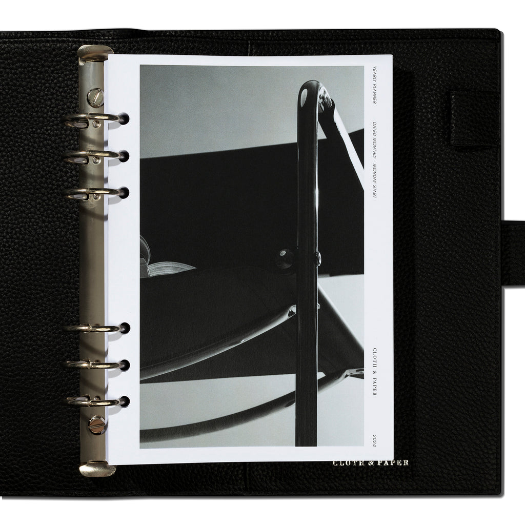 A5 insert in use inside a black leather agenda.