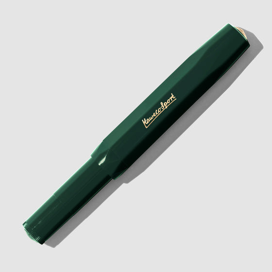 Dark Green Rollerball pen displayed with cap on a neutral background.