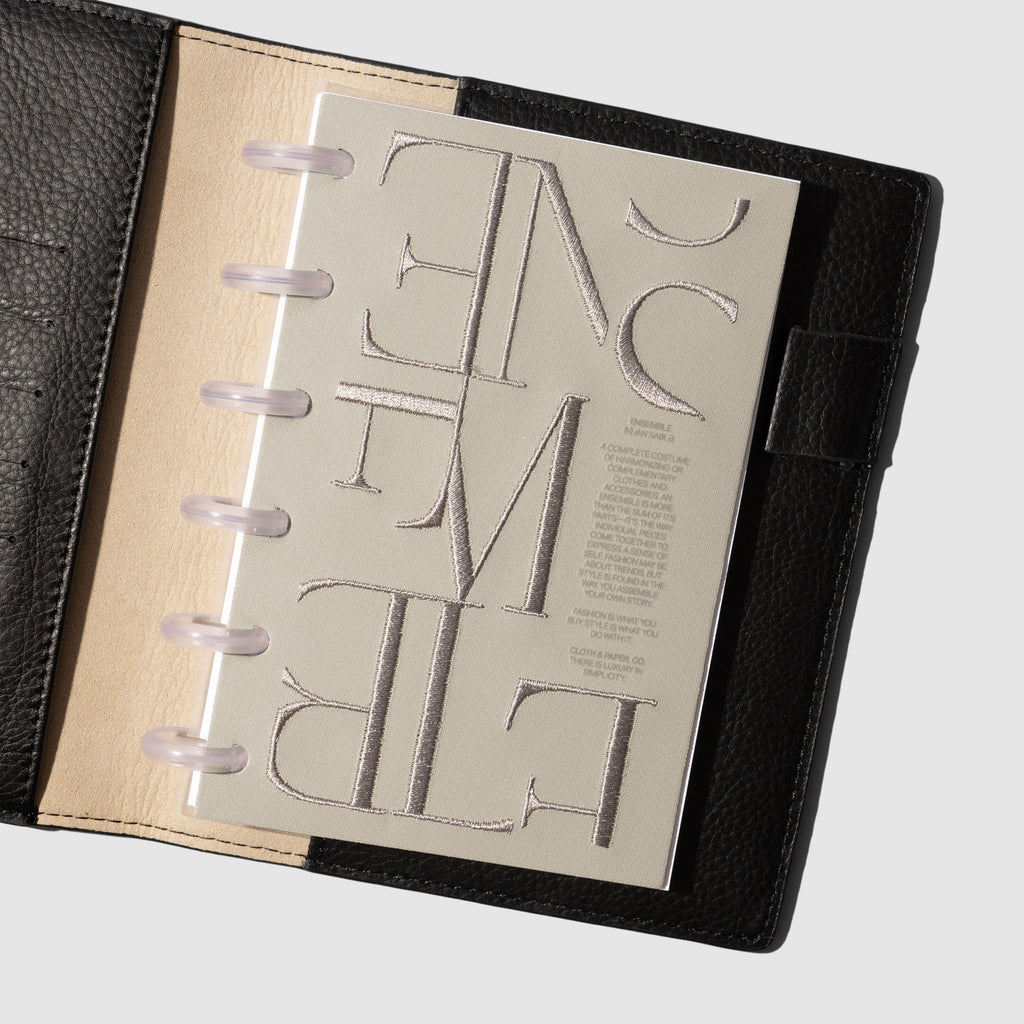 Dashboard displayed in a black planner on a neutral background. Size shown is CP Petite.