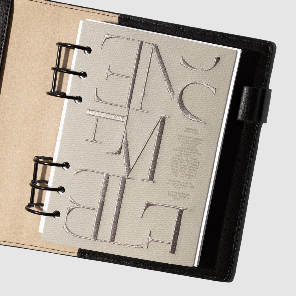 Dashboard displayed in a black planner on a neutral background. Size shown is Personal Wide.