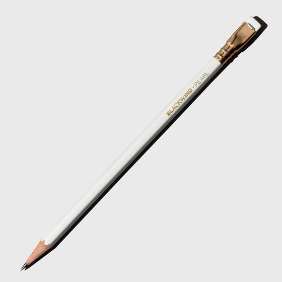 The image shows the blackwing pearl pencil. It features a white pencil with a matching tapered eraser set in gold.