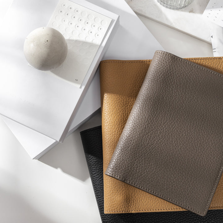Heirloom Leather Folios on a white desk with accessories