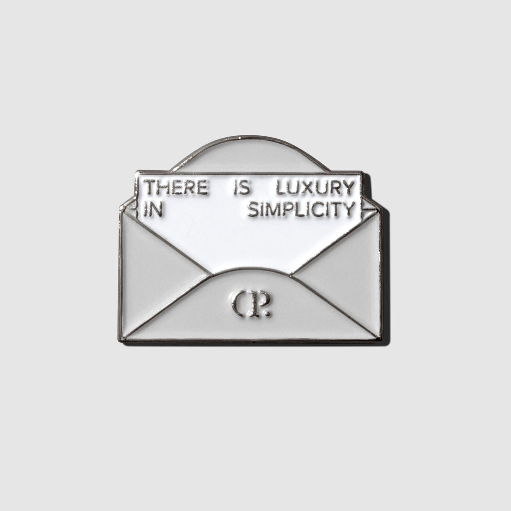 Envelope enamel pin displayed on a neutral background.