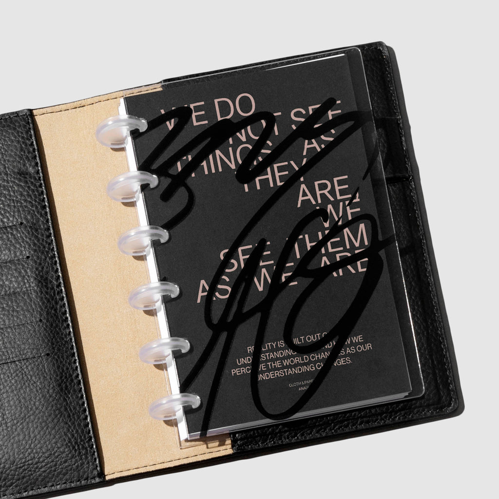 Cover and  dashboard shown on a neutral background inside a leather planner.