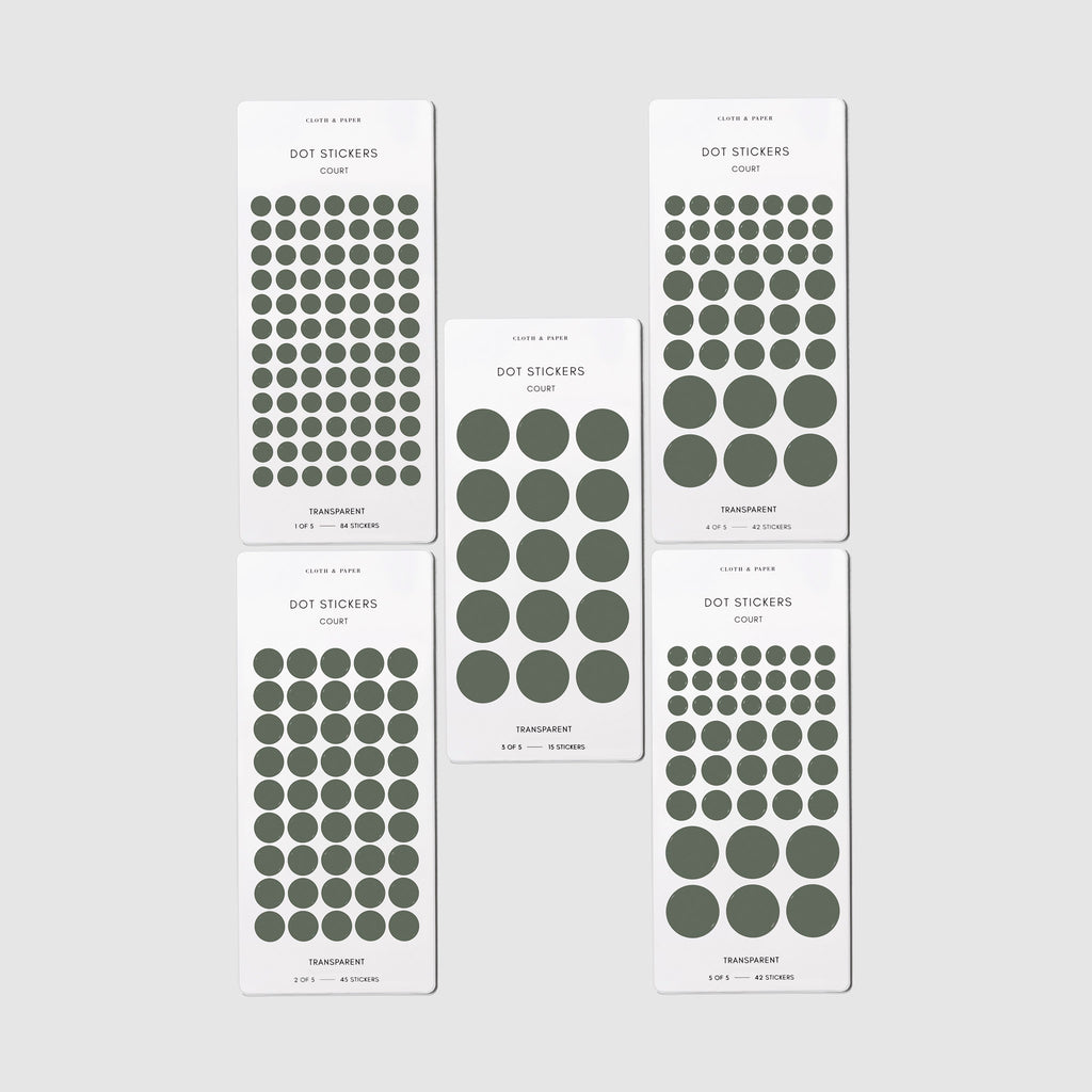 Stickers shown in their packaging on a neutral background. Five sheets are shown, showcasing small, medium, and large stickers.