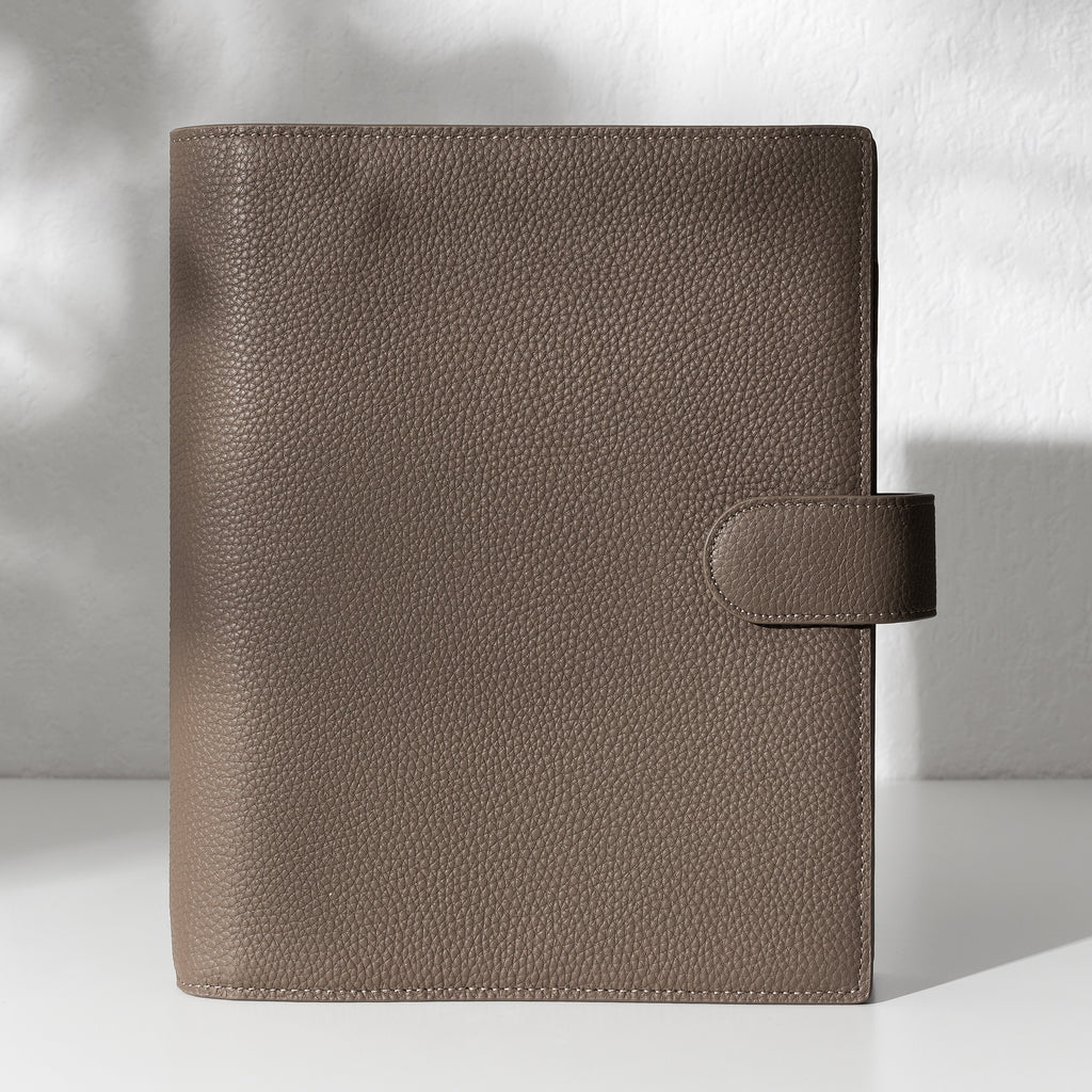 Cortado leather agenda displayed on an off-white background.