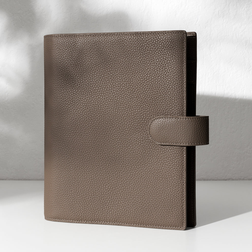 Cortado leather agenda displayed on an off-white background.