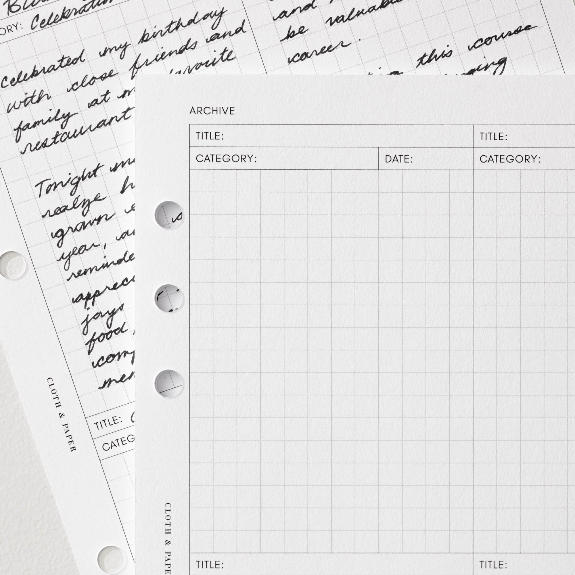 A couple example sheets of the Archive Planner Inserts.  A corner of one sheet is filled out while another sheet's corner is blank.