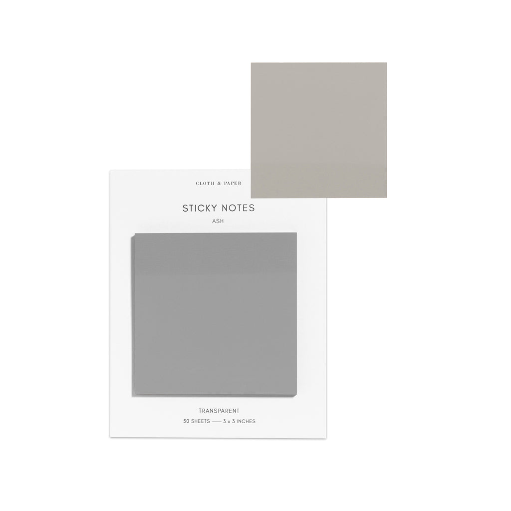 Sticky notes on their backing displayed on a white background. One sticky note is displayed on the corner of the backing to show its transparency. Color pictured is Ash.