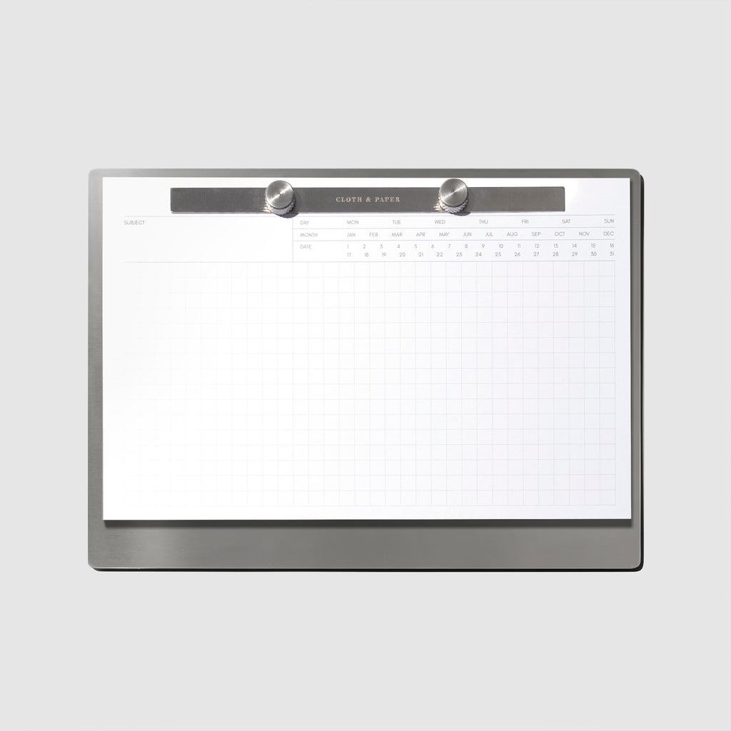 Modern Bound Notepad Insert Refills, executive notes, filled on the Modern Bound Notepad board, resting on a light gray background