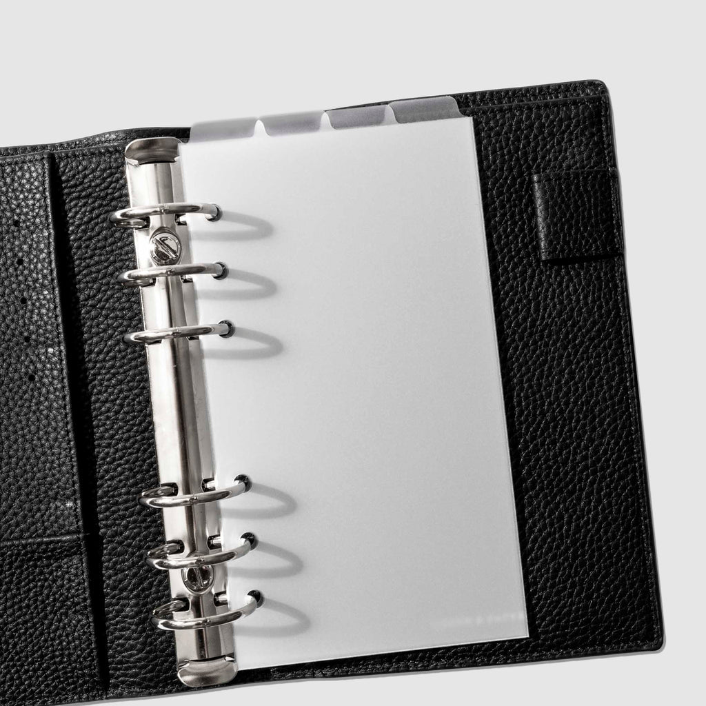 Personal Dividers in use inside a black leather planner.