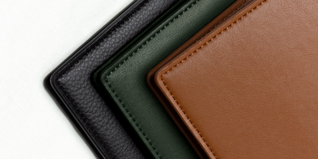 The top corner edge of Mesa, Valley, and Clay Conscious Leather Vegan Folios set against a white background.