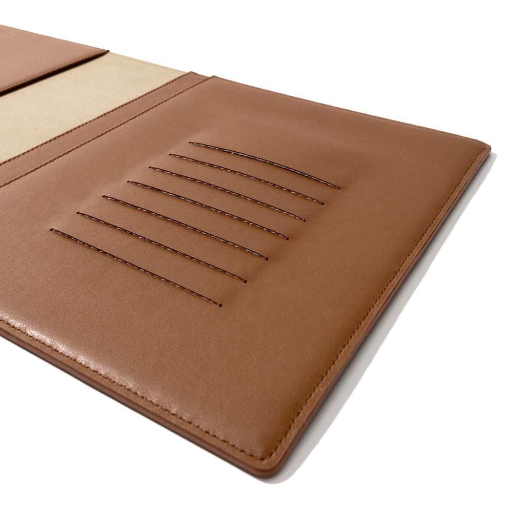 Closeup of folio's credit card slots. Color pictured is clay brown.