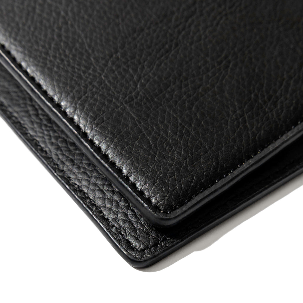 Closeup of mesa black folio's textured vegan leather.
