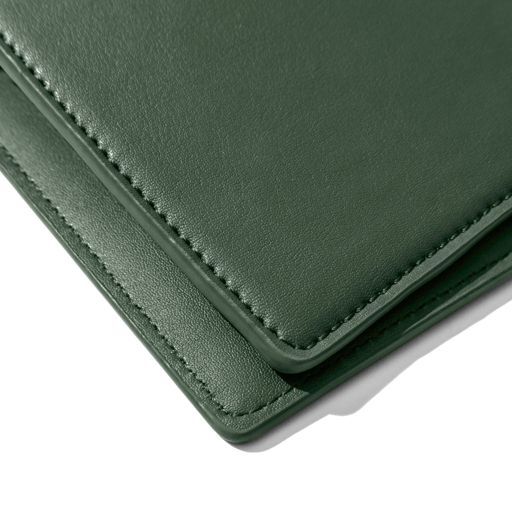 Closeup of valley green folio's smooth vegan leather.