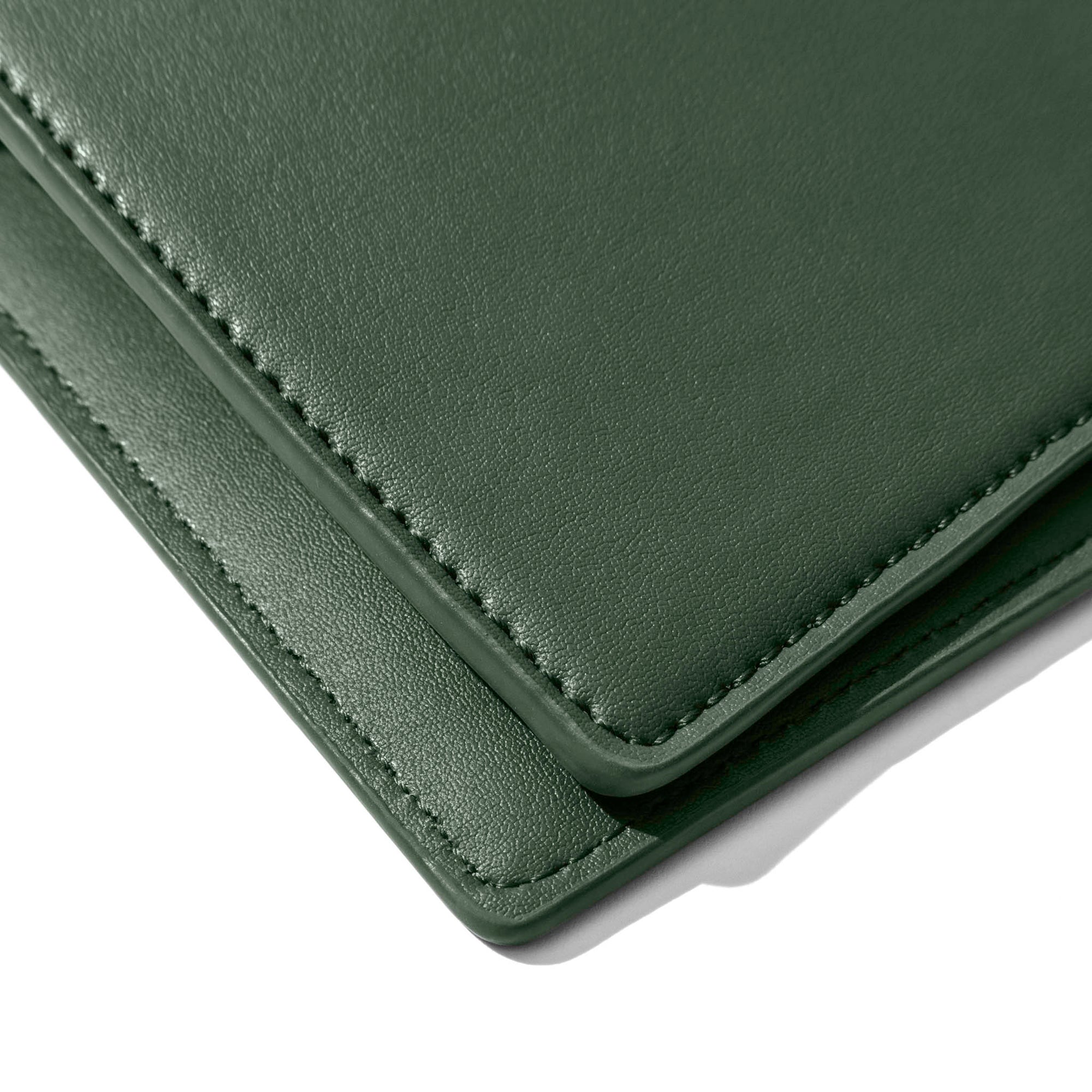 Closeup of valley green folio's smooth vegan leather.