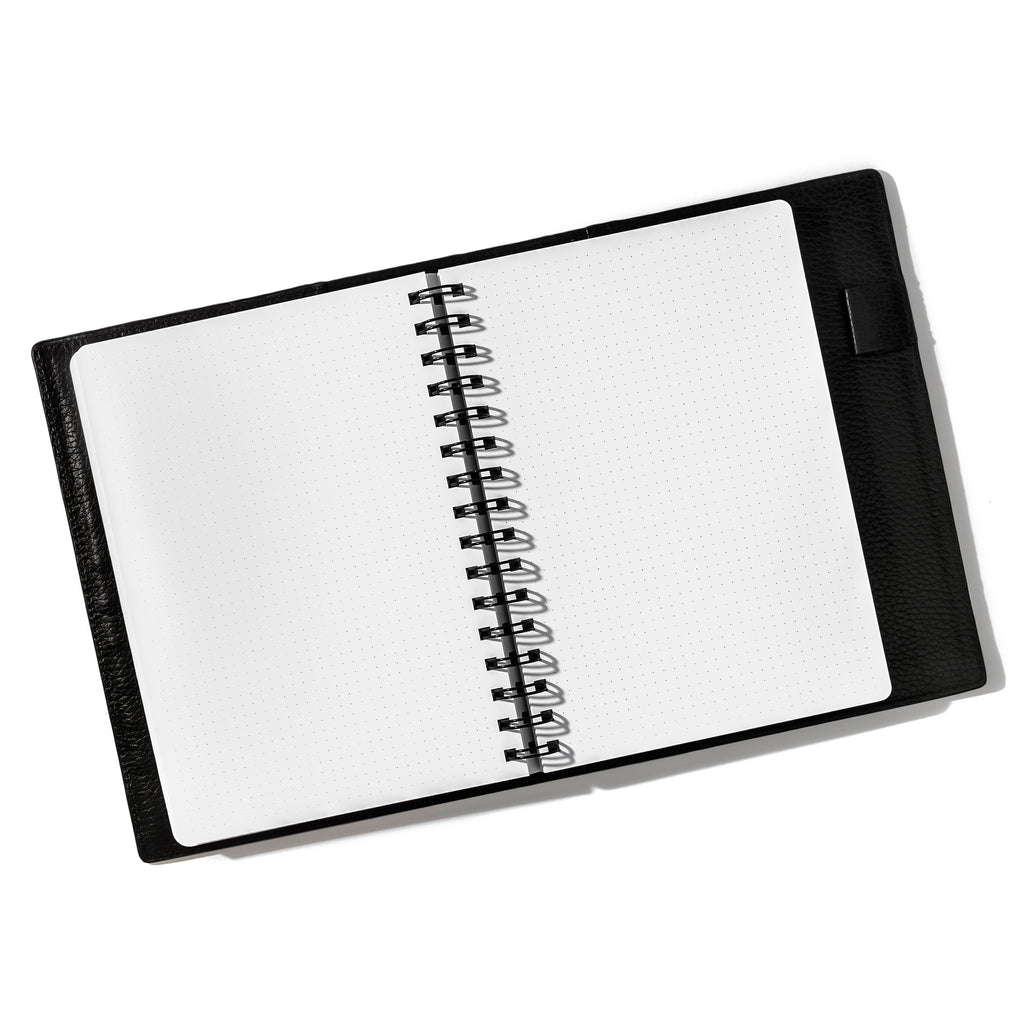 Notebook inside of a leather folio. Notebook displayed on a white background. Color pictured is Avant Garde.