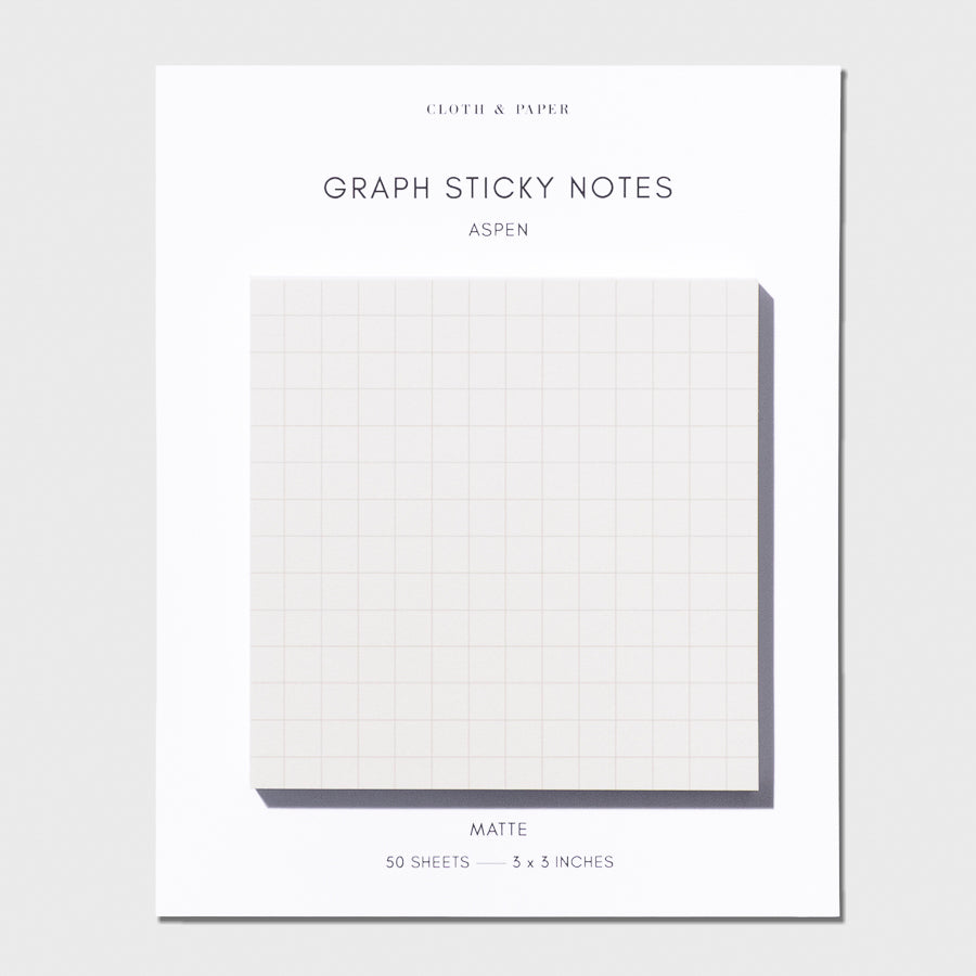 Graph Sticky Notes on their backing on a light gray background