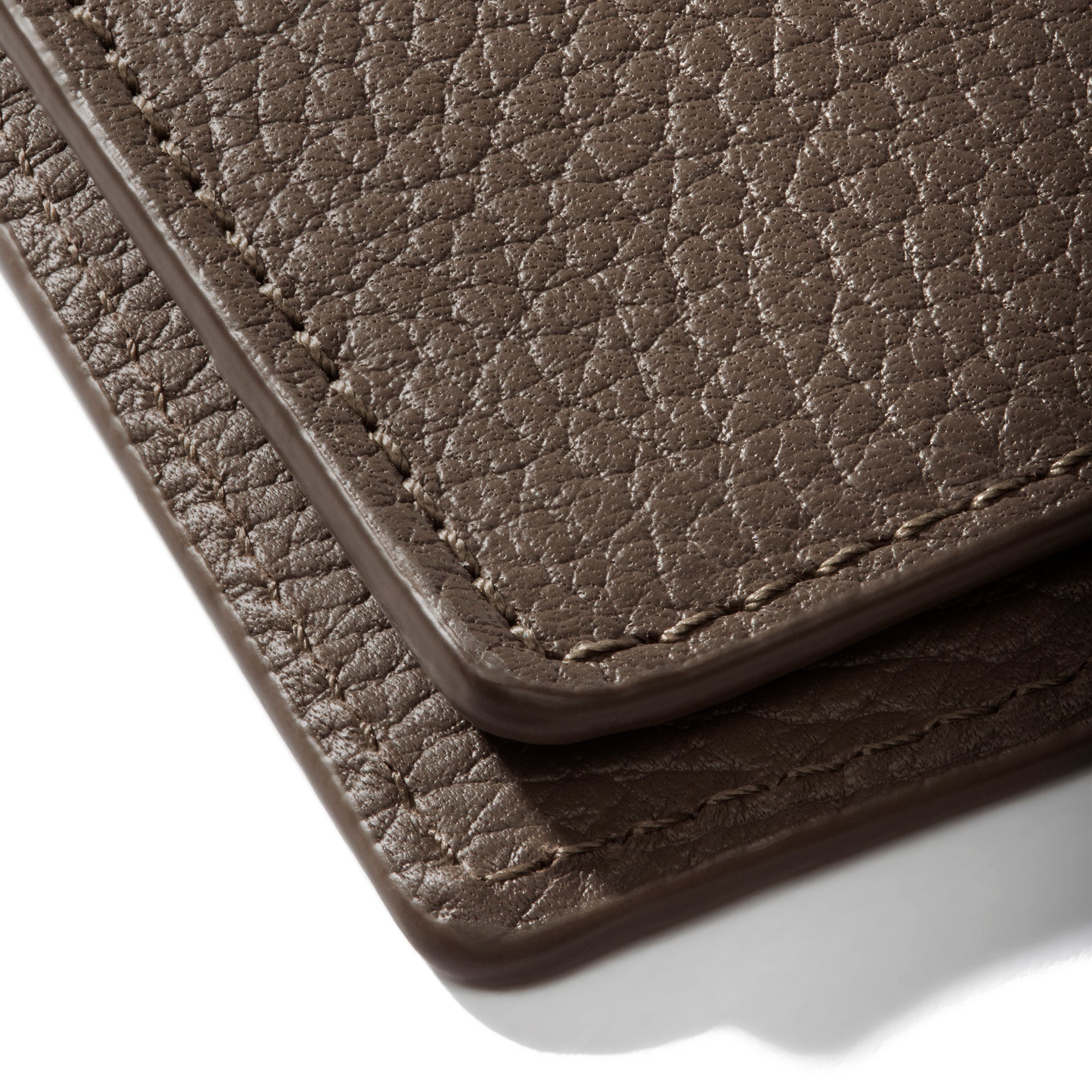 Closeup of Leon folio showing the stitching and glazing.