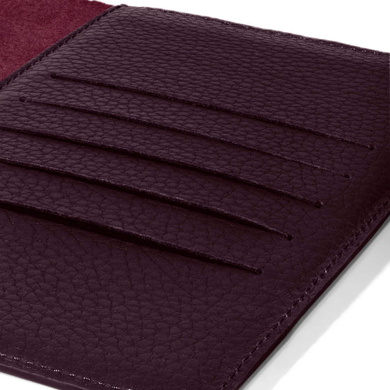 Closeup of credit card slots inside leather folio.