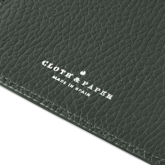 Closeup of silver stamping on leather folio.