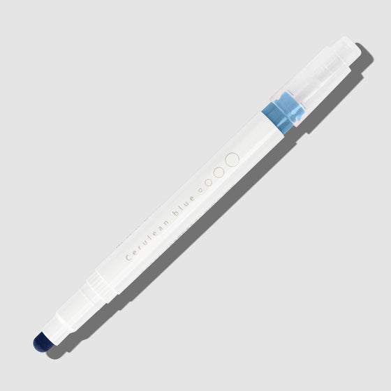 Cerulean Blue highlighter with tip exposed and cap posted to the end of its barrel on a white background.