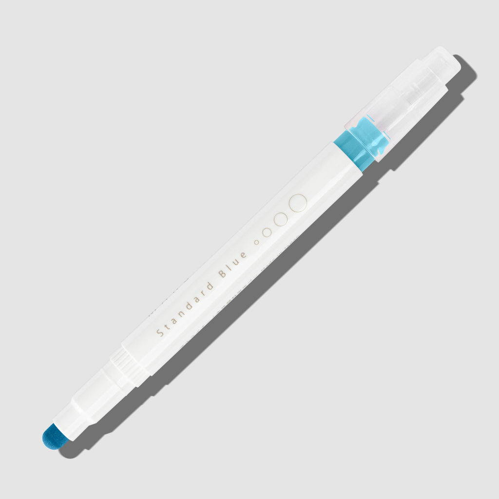 Standard Blue highlighter with tip exposed and cap posted to the end of its barrel on a white background.