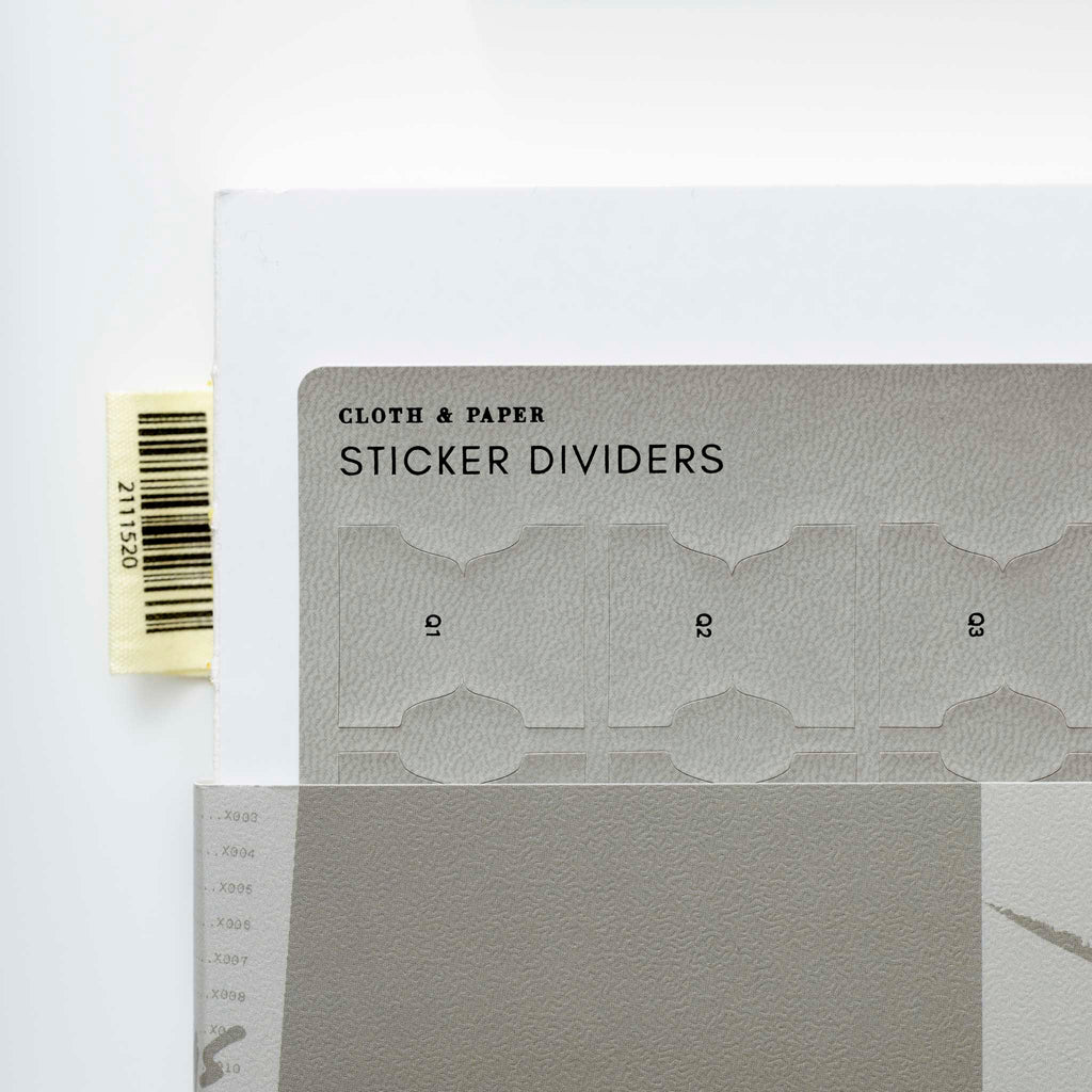 A corner of the new Leather Sticker Dividers against a white background.