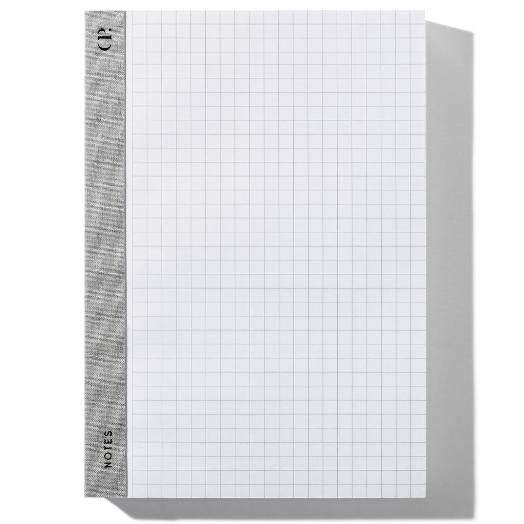 Left Bound Graph Notepad, A5, Cloth and Paper. Notepad positioned vertically on a white background. 