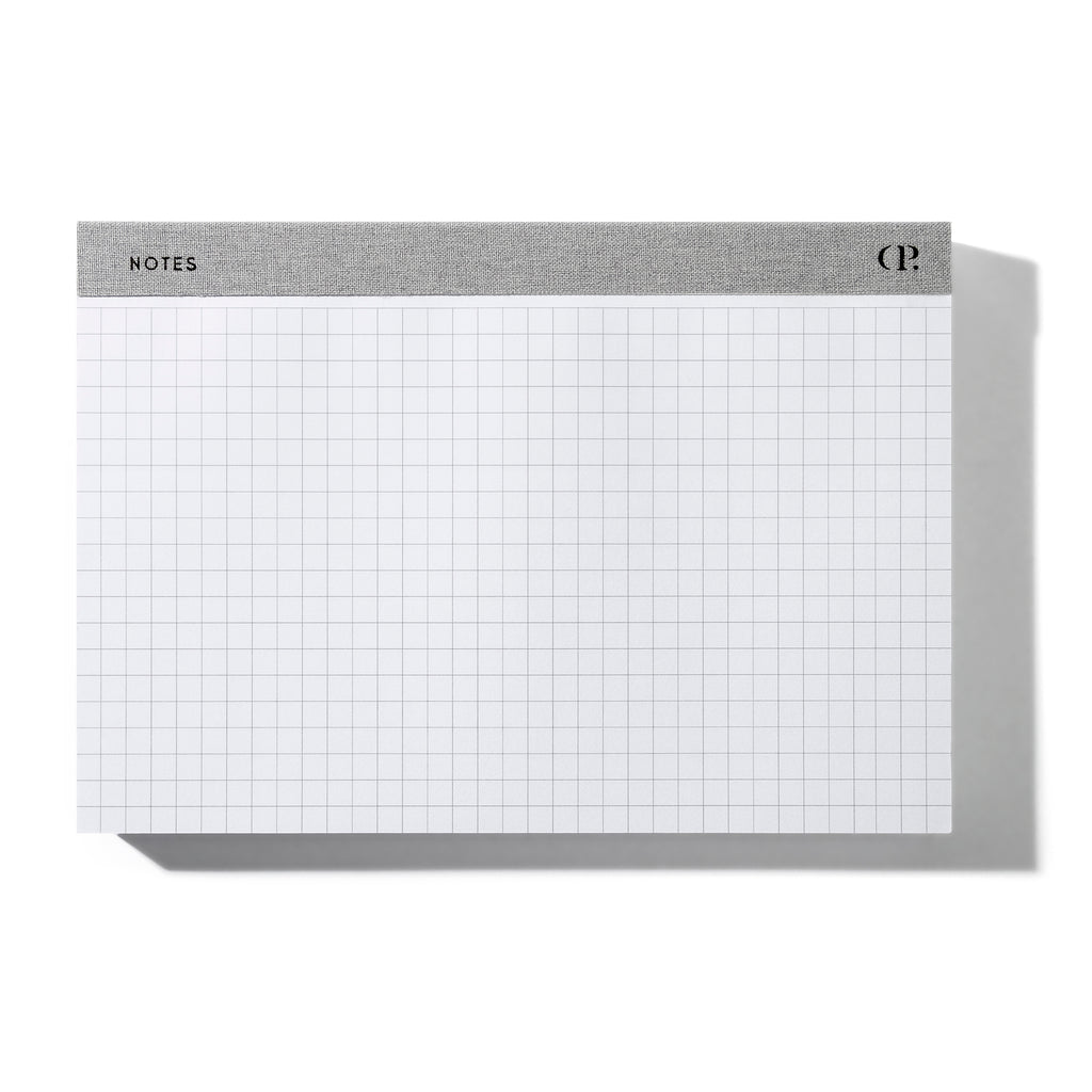 Notepad positioned horizontally on a white background.