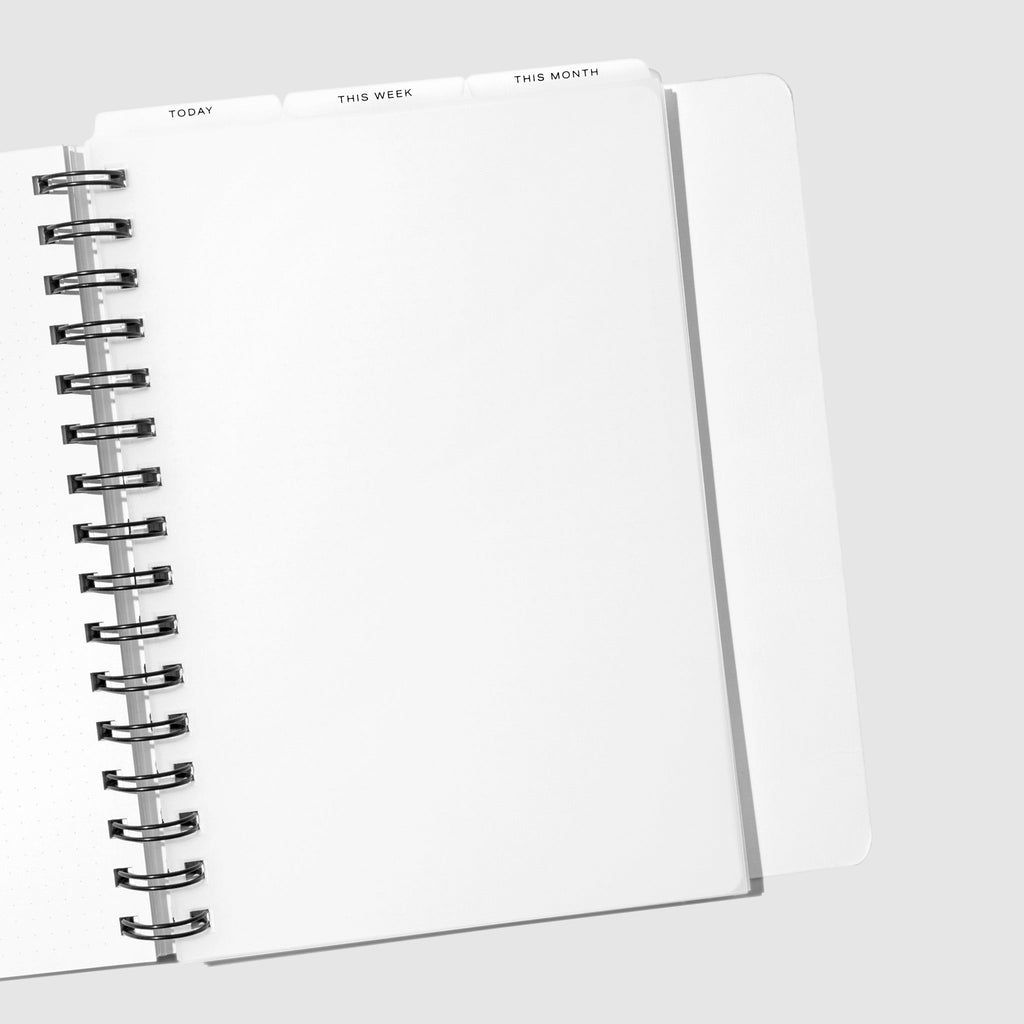 A5 Spiral Black Foil Cadence Tab Dividers displayed in a spiral planner.