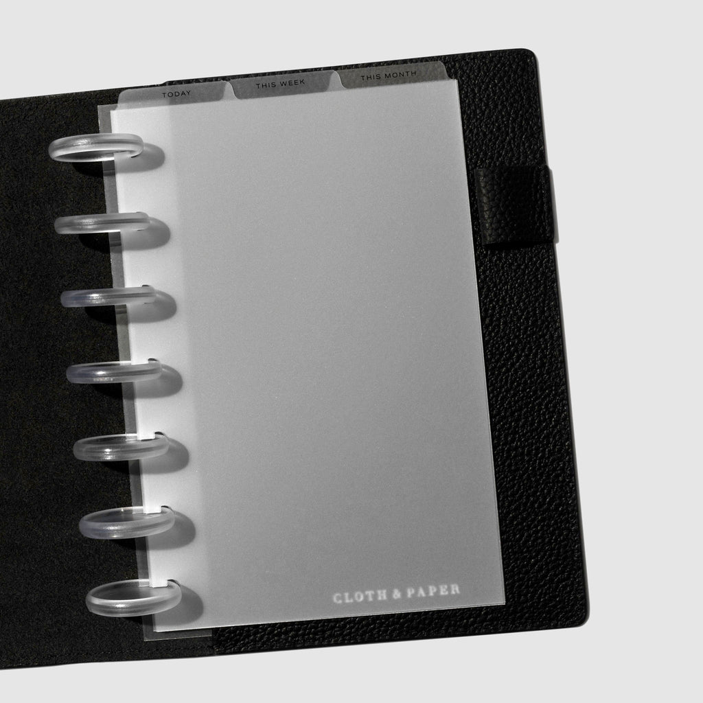 HP Mini Black Foil Cadence Tab Dividers displayed in a black leather planner.