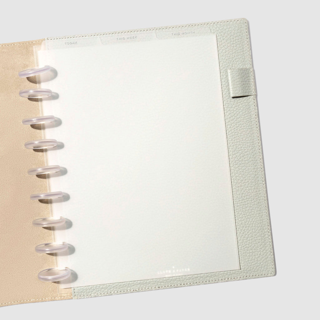 HP Classic White Foil Cadence Tab Dividers displayed in a gray leather planner.