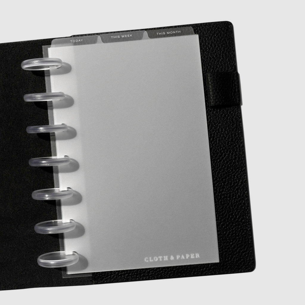 HP Mini White Foil Cadence Tab Dividers displayed in a black leather planner.