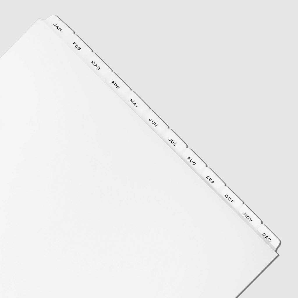 Closeup of black foil tabs displayed on a white background.